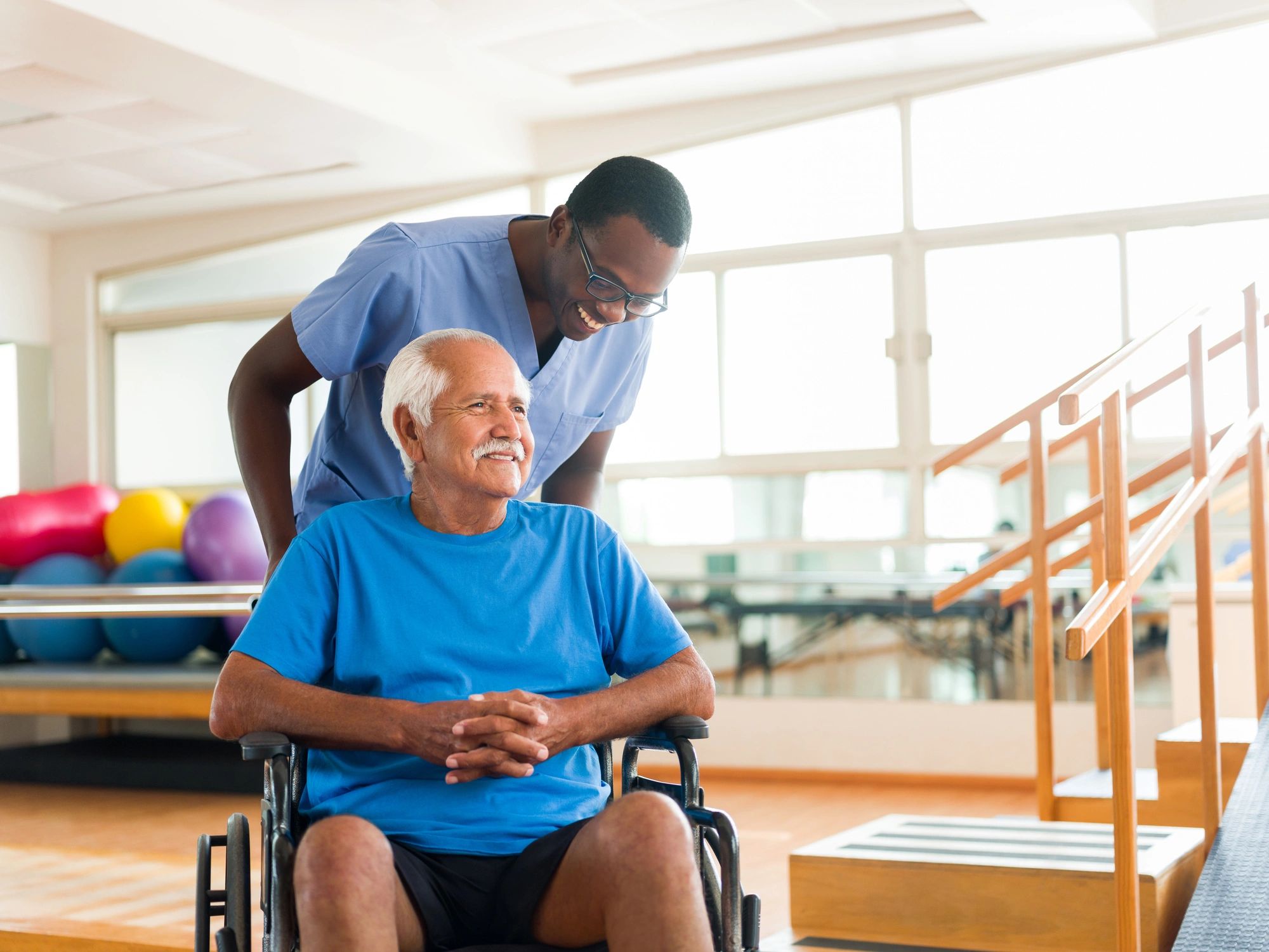 Caregiver supporting an adult client with mobility assistance