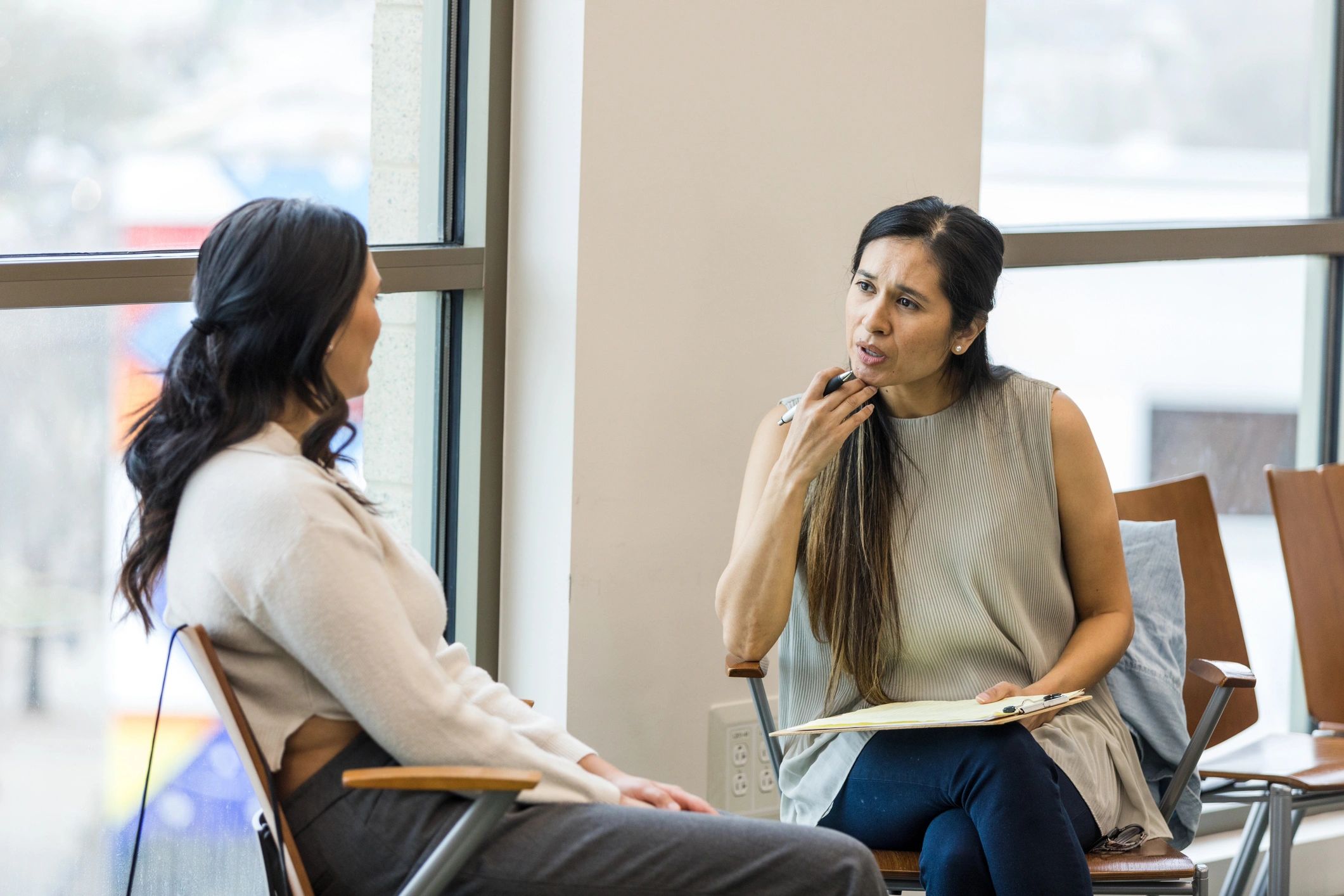 Professional caregiver listening attentively during a support session