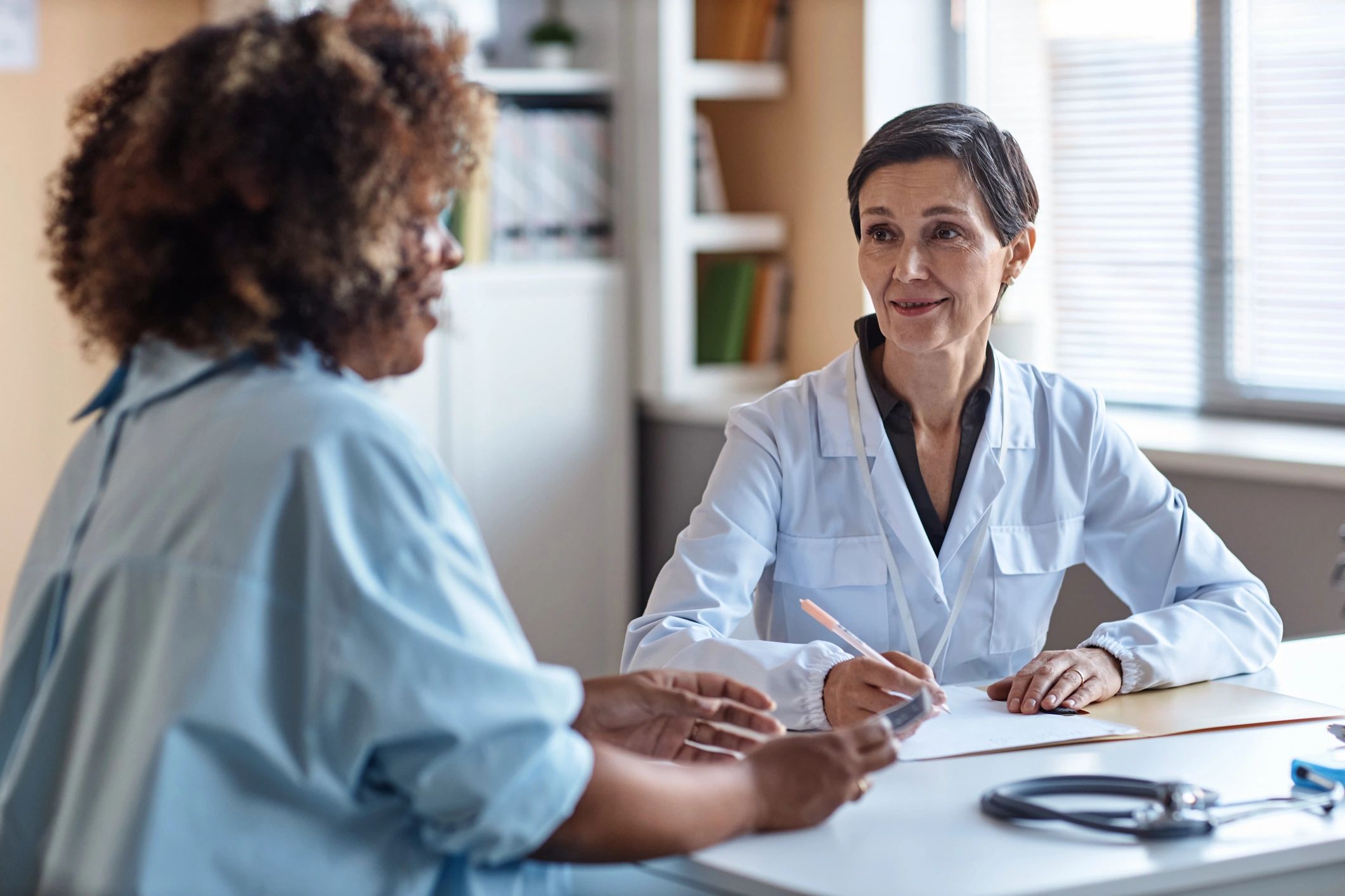 Smiling client consultation in a care setting