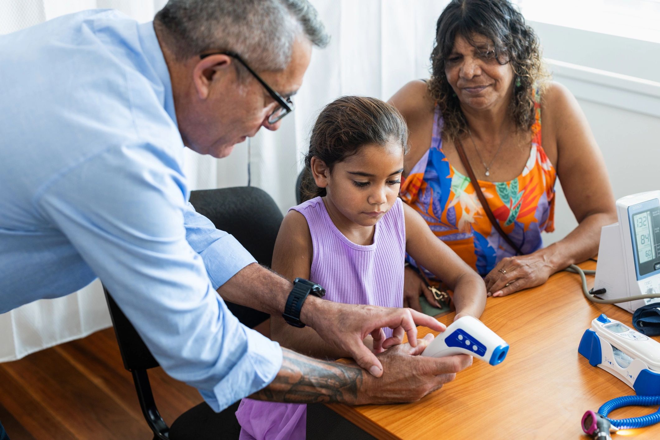Healthcare professional supporting a family