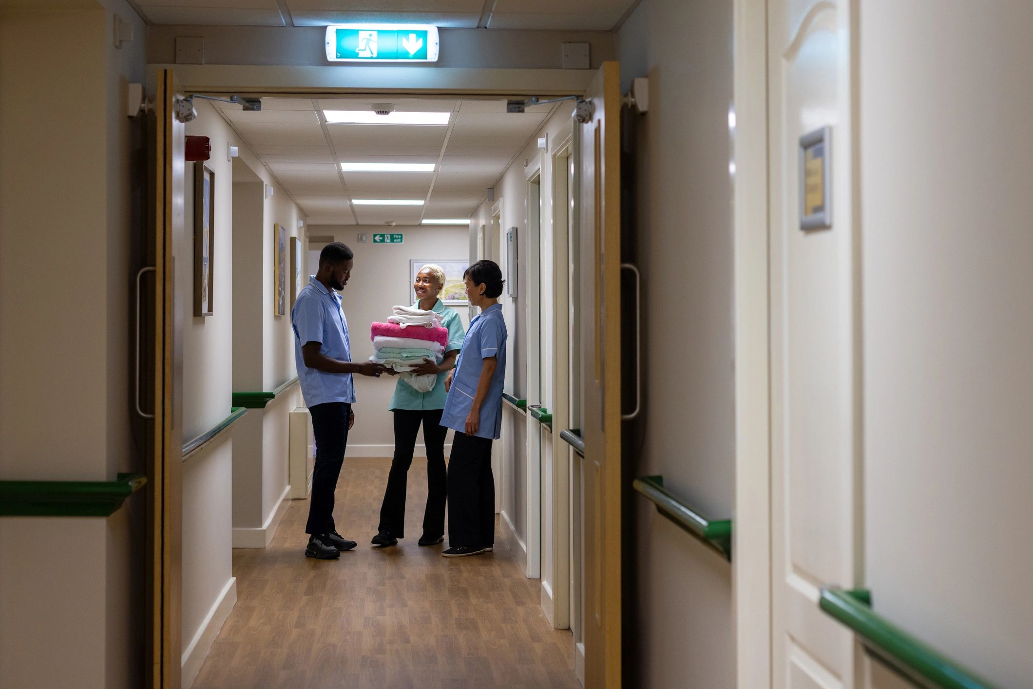 Healthcare support team smiling together in a care setting